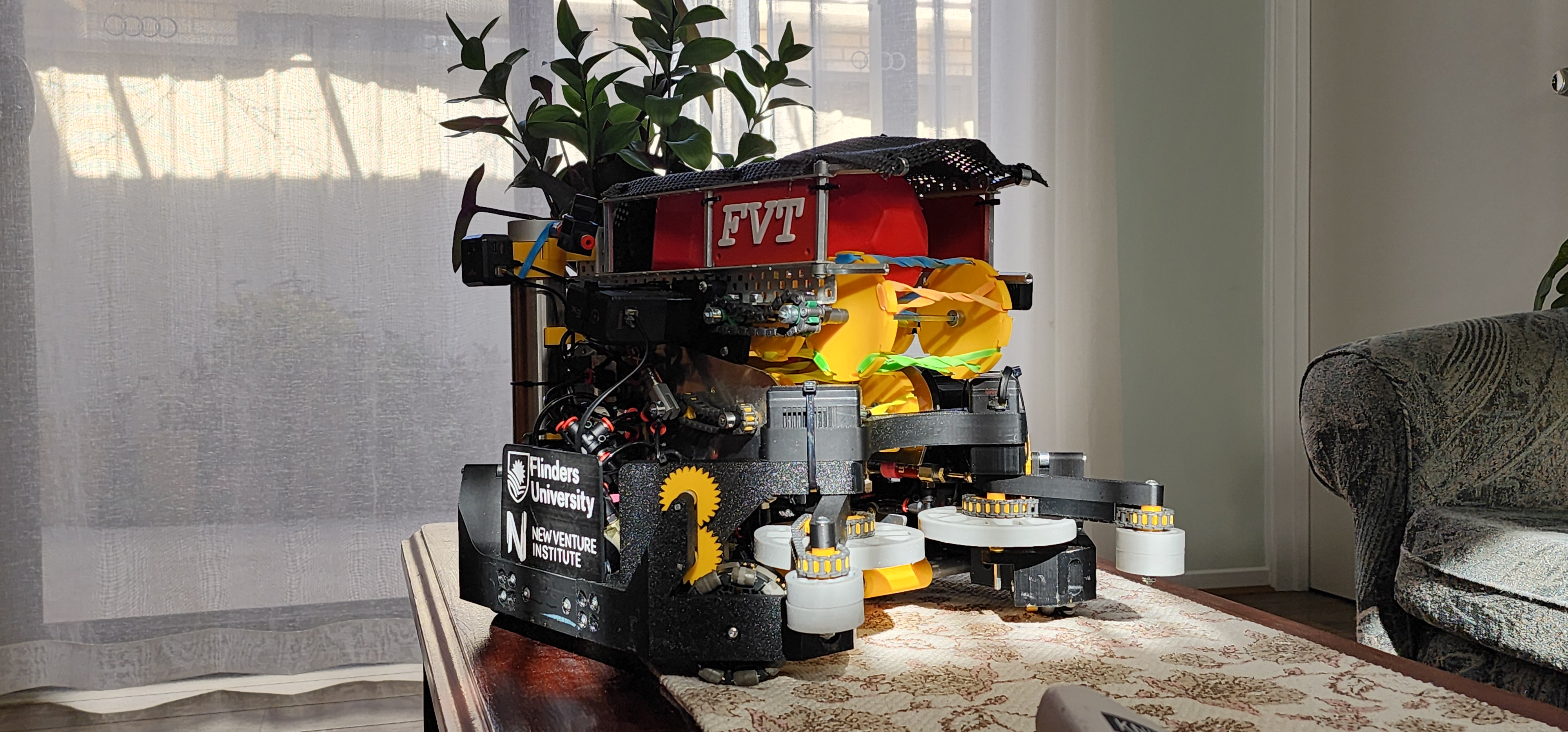 Picture of a black and yellow robot.